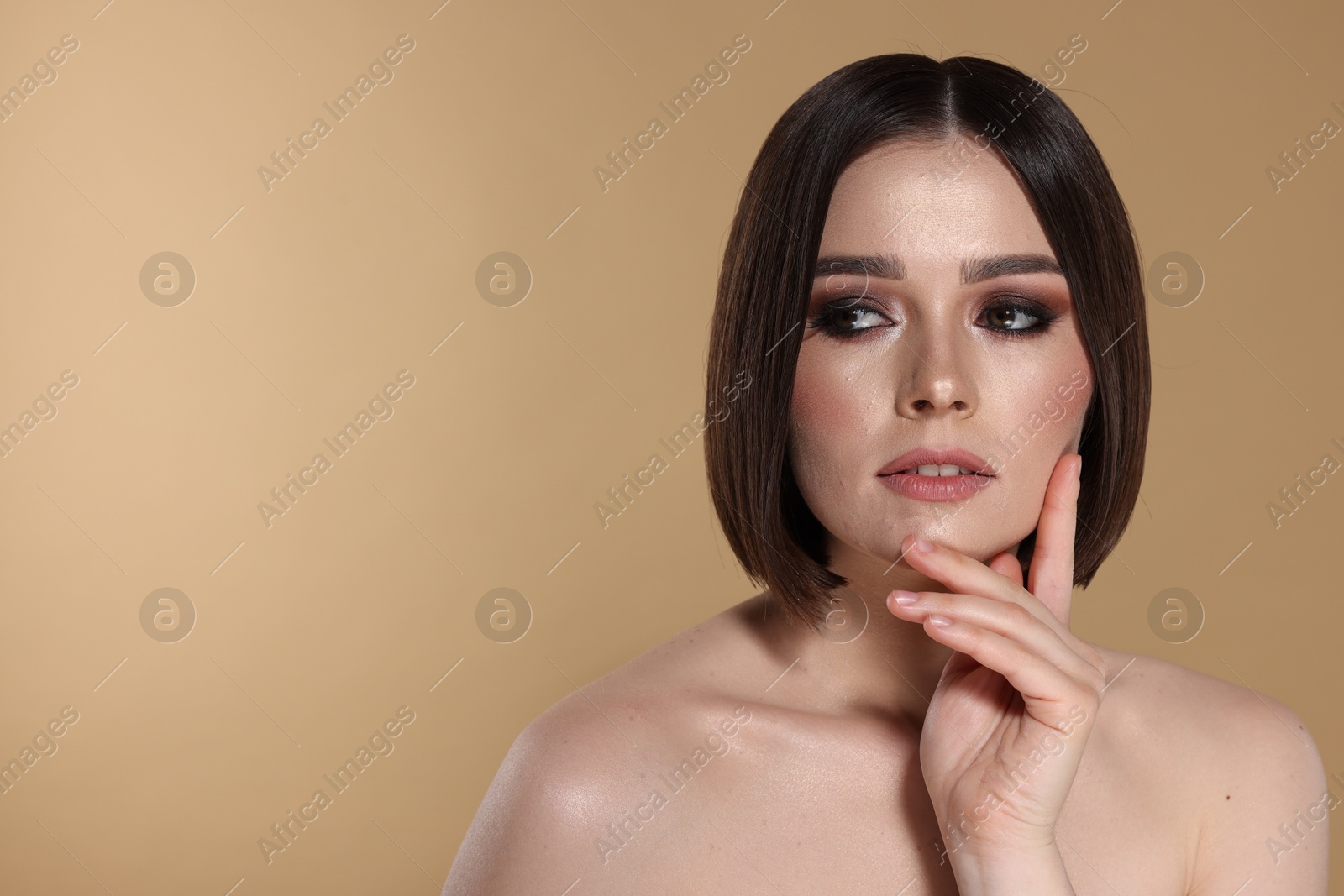 Photo of Portrait of beautiful young woman with gorgeous straight hair on beige background, space for text