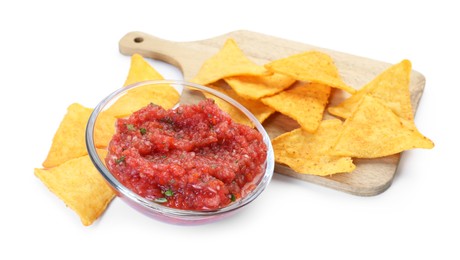 Spicy salsa sauce in glass bowl and nachos isolated on white