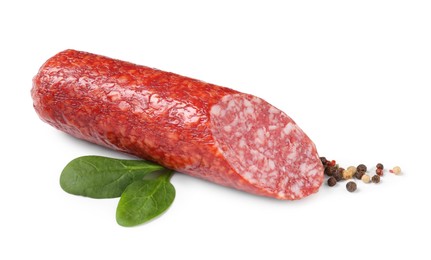 Photo of Piece of delicious smoked sausage with basil and peppercorns isolated on white