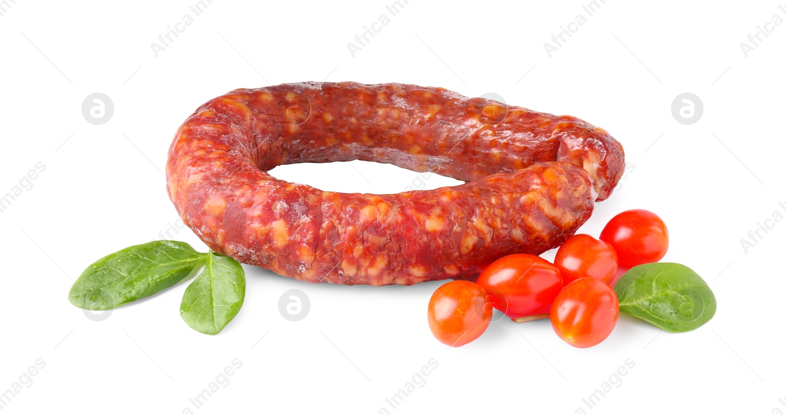 Photo of Delicious dry cured sausage with basil and tomatoes isolated on white