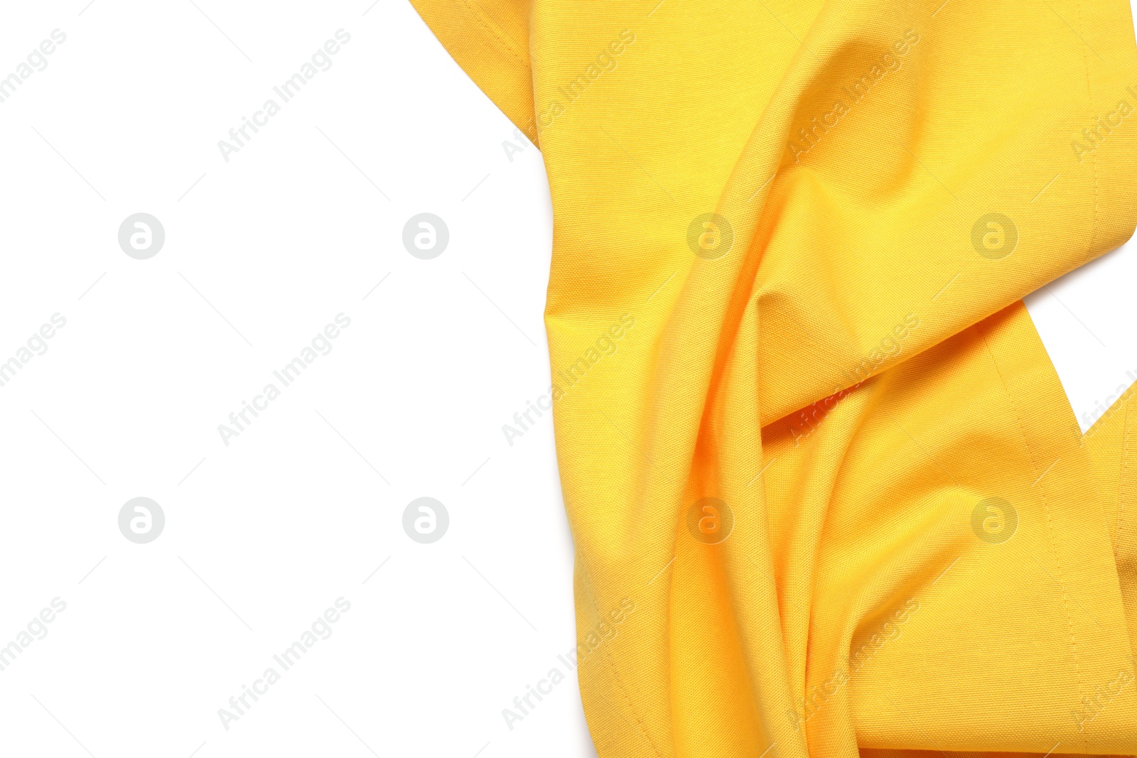 Photo of Yellow tablecloth isolated on white, top view