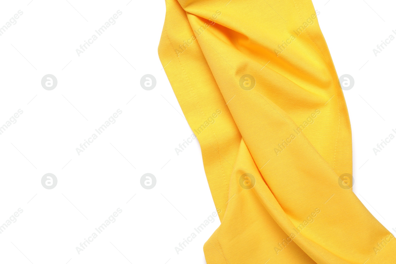 Photo of Yellow tablecloth isolated on white, top view