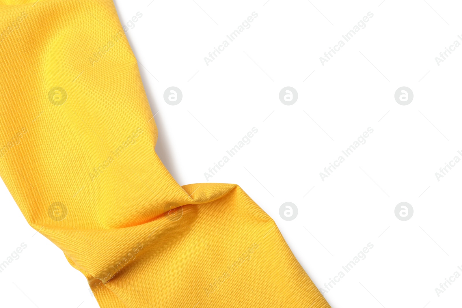 Photo of Yellow tablecloth isolated on white, top view