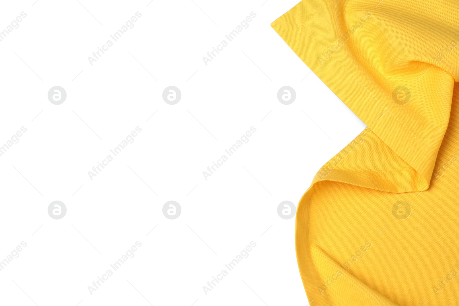 Photo of Yellow tablecloth isolated on white, top view