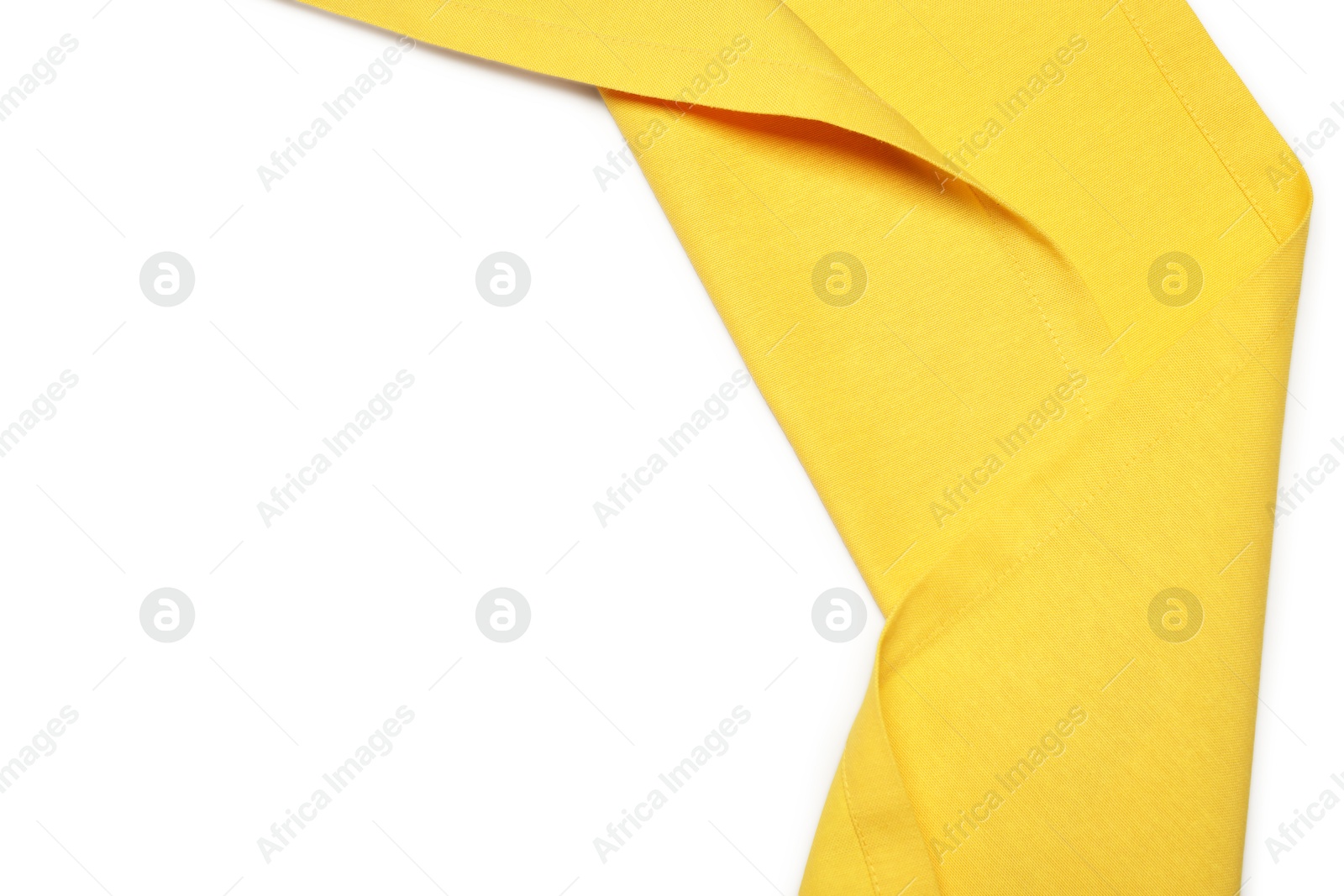 Photo of Yellow tablecloth isolated on white, top view