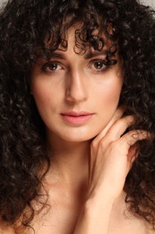 Photo of Beautiful young woman with long curly hair