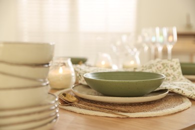 Photo of Stylish table setting with dishware and cutlery indoors