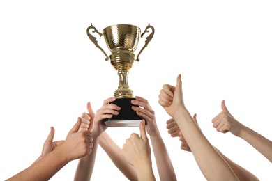 Photo of Group of people with golden trophy up on white background, closeup