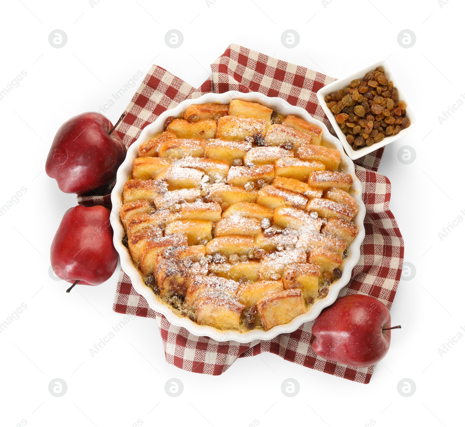 Photo of Delicious bread pudding with raisins, powdered sugar and apples isolated on white, top view