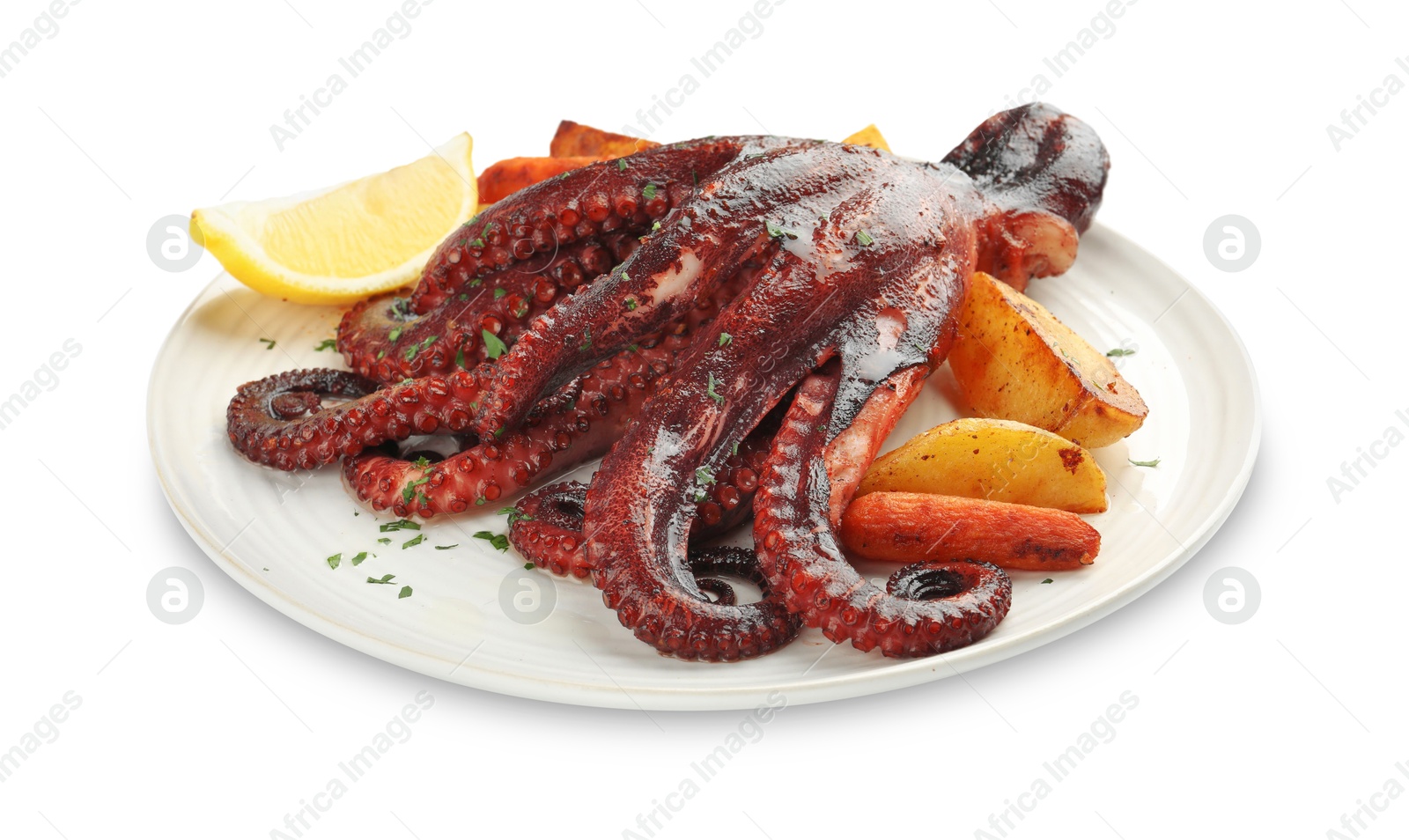 Photo of Roasted octopus with vegetables and lemon isolated on white