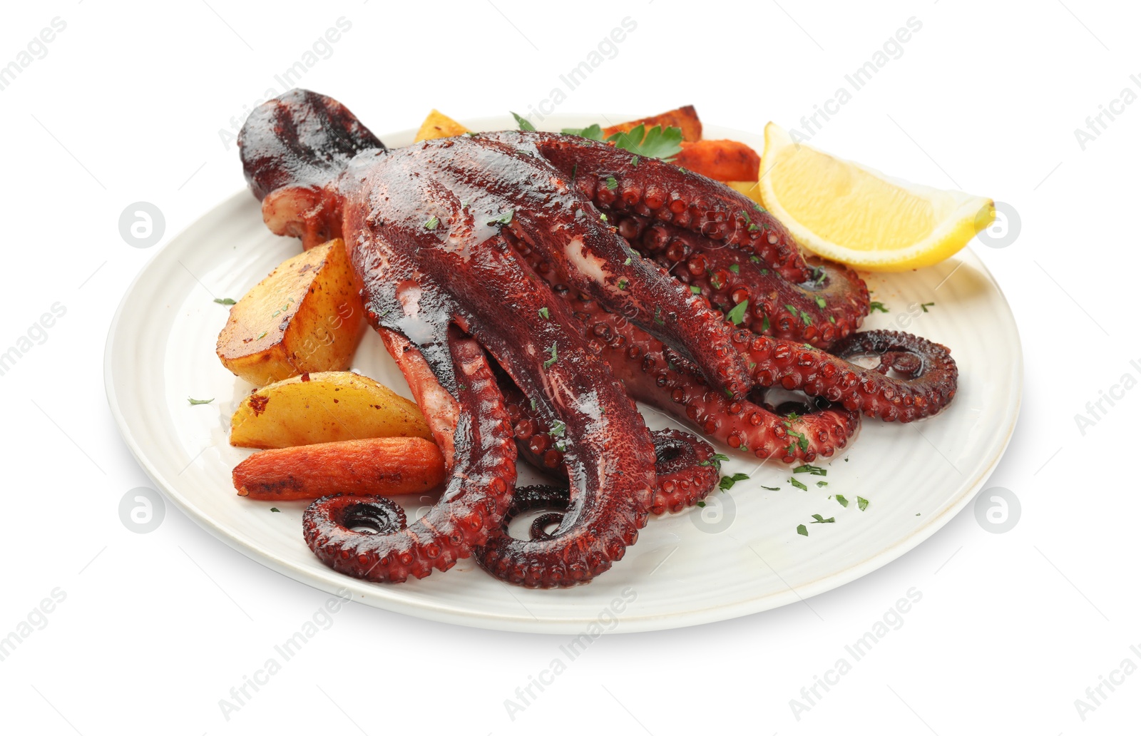 Photo of Roasted octopus with vegetables and lemon isolated on white