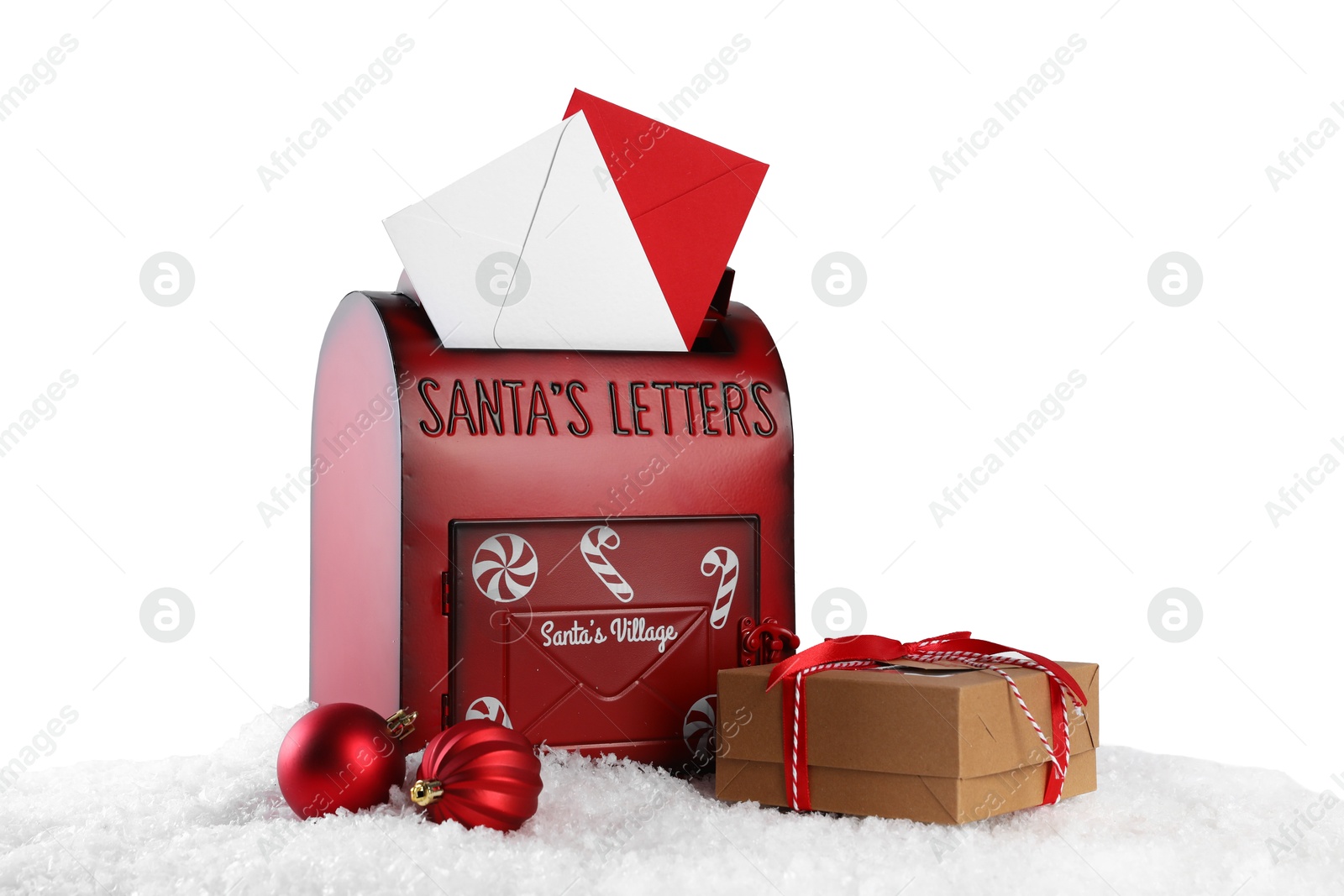 Photo of Santa Claus mail box with letters, gift and Christmas baubles on artificial snow against white background