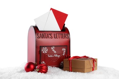 Photo of Santa Claus mail box with letters, gift and Christmas baubles on artificial snow against white background