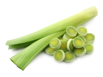 Photo of Whole and cut leeks isolated on white, top view