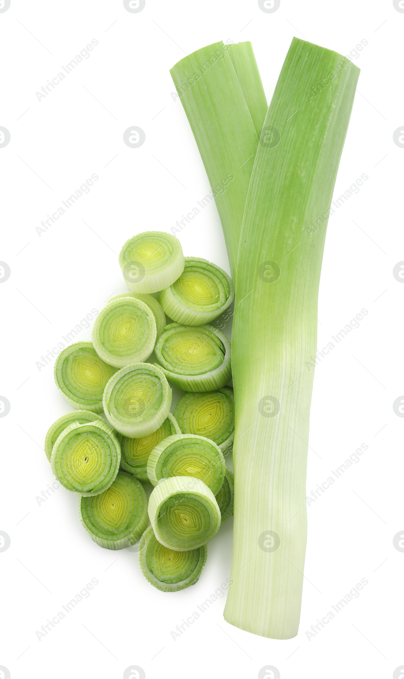 Photo of Whole and cut leeks isolated on white, top view