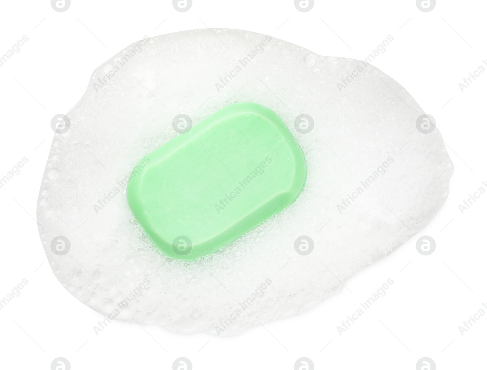 Photo of Green soap with foam on white background, top view