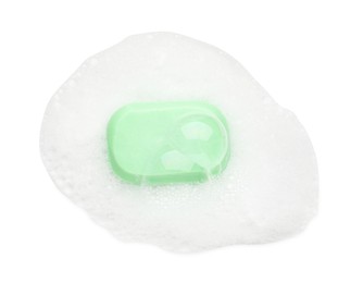 Photo of Green soap with foam on white background, top view