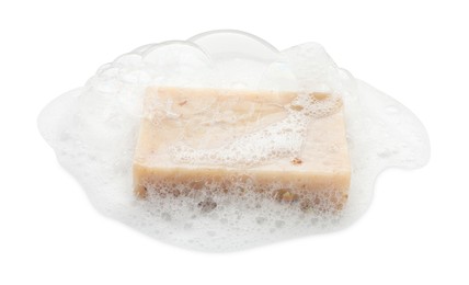 Photo of Bar soap with foam on white background