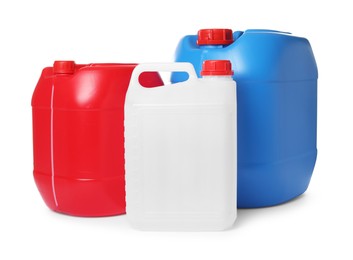 Photo of Three colorful plastic canisters isolated on white