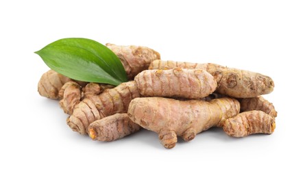 Photo of Raw turmeric roots and green leaf isolated on white