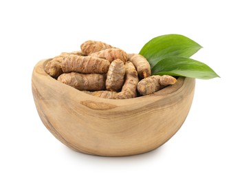 Photo of Raw turmeric roots and green leaves in bowl isolated on white