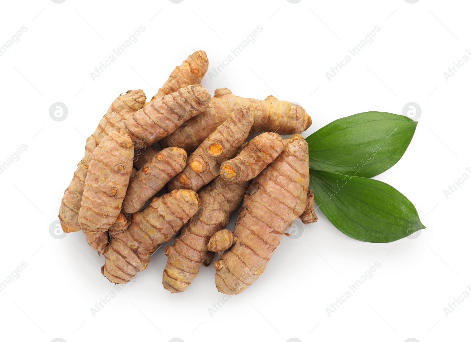 Photo of Raw turmeric roots and green leaves isolated on white, top view