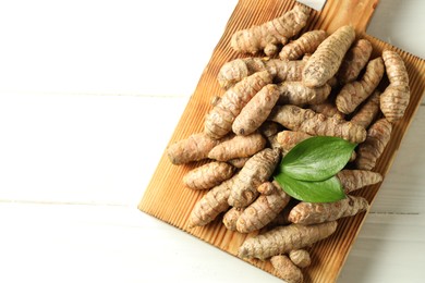 Photo of Tumeric rhizomes on white table, top view