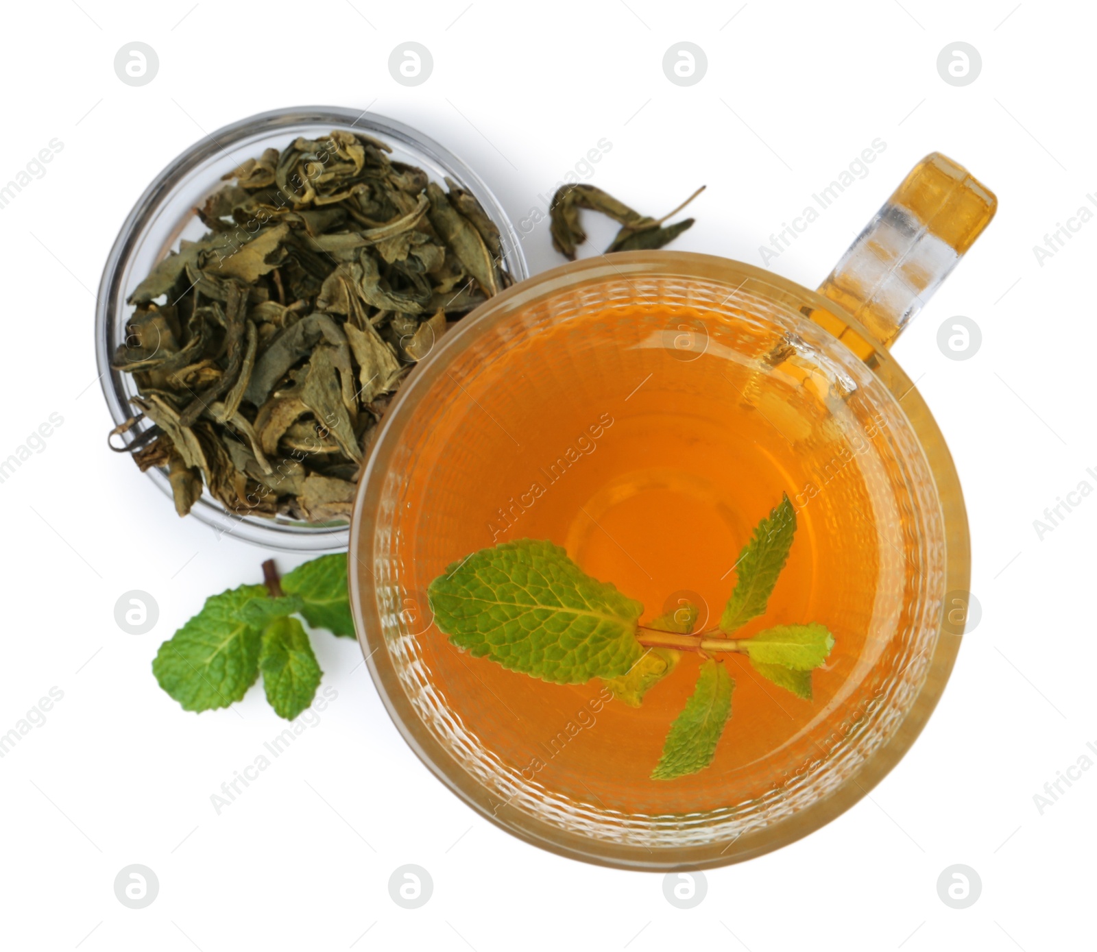 Photo of Aromatic mint tea, fresh and dried leaves isolated on white