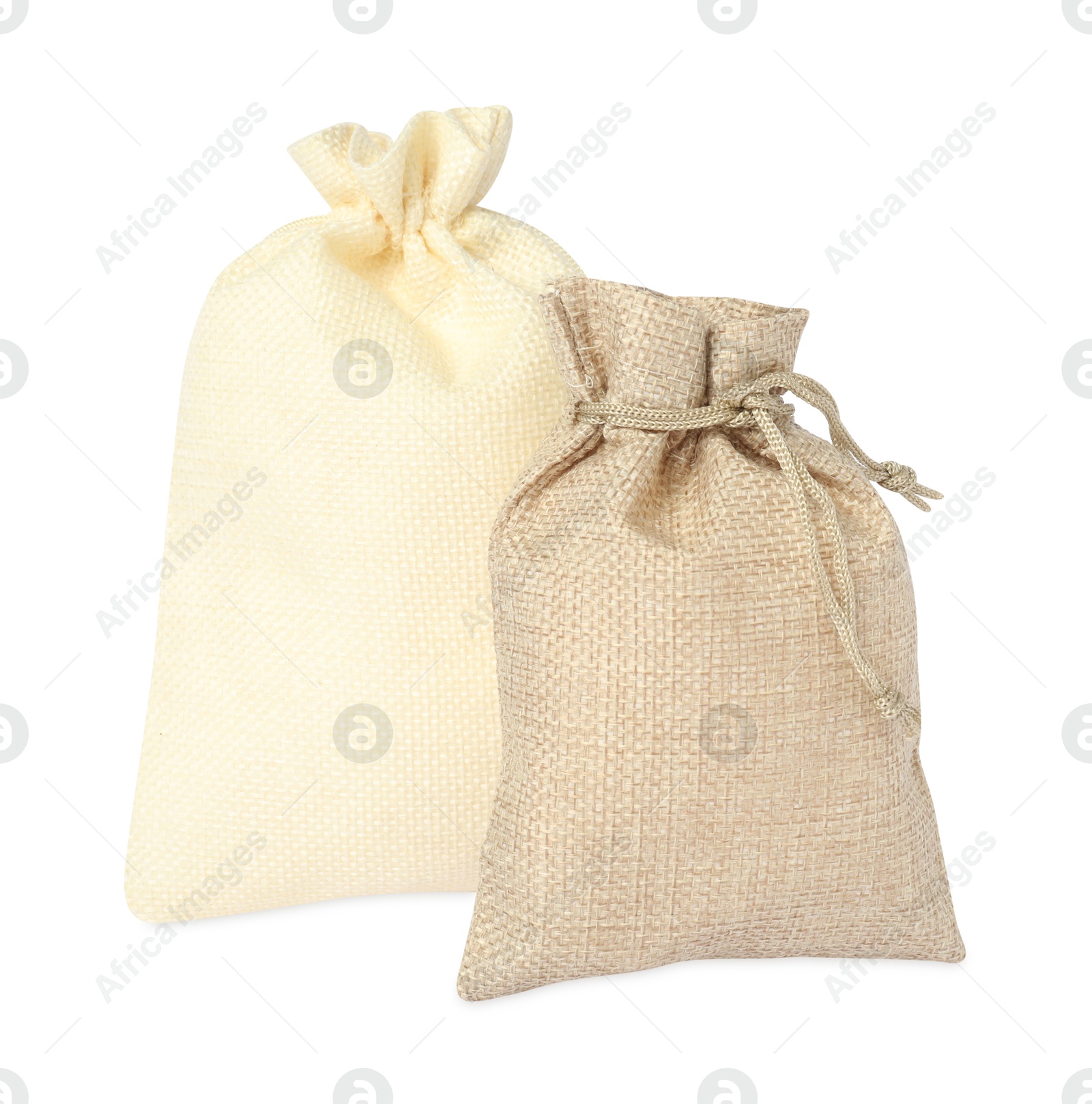 Photo of Two beige burlap sacks isolated on white