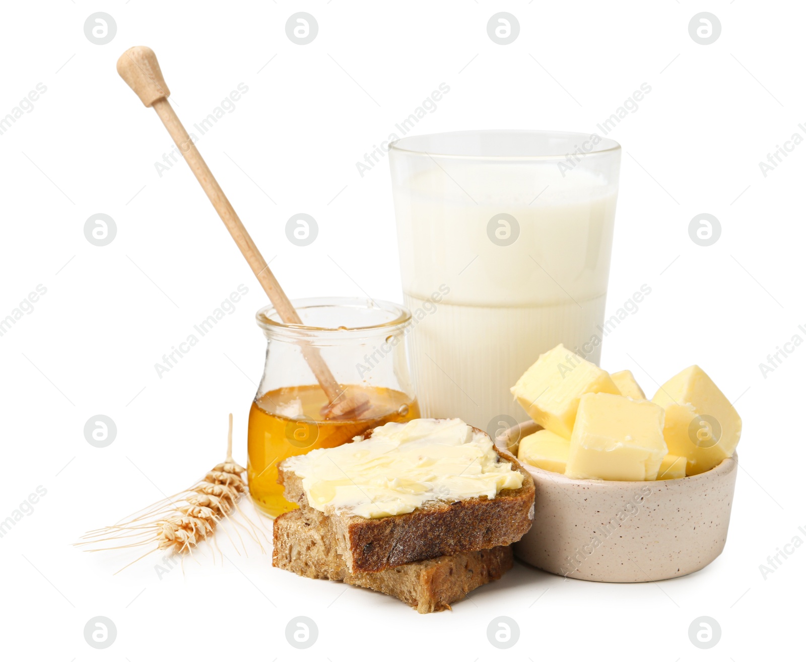 Photo of Tasty sandwich, butter, honey and milk isolated on white