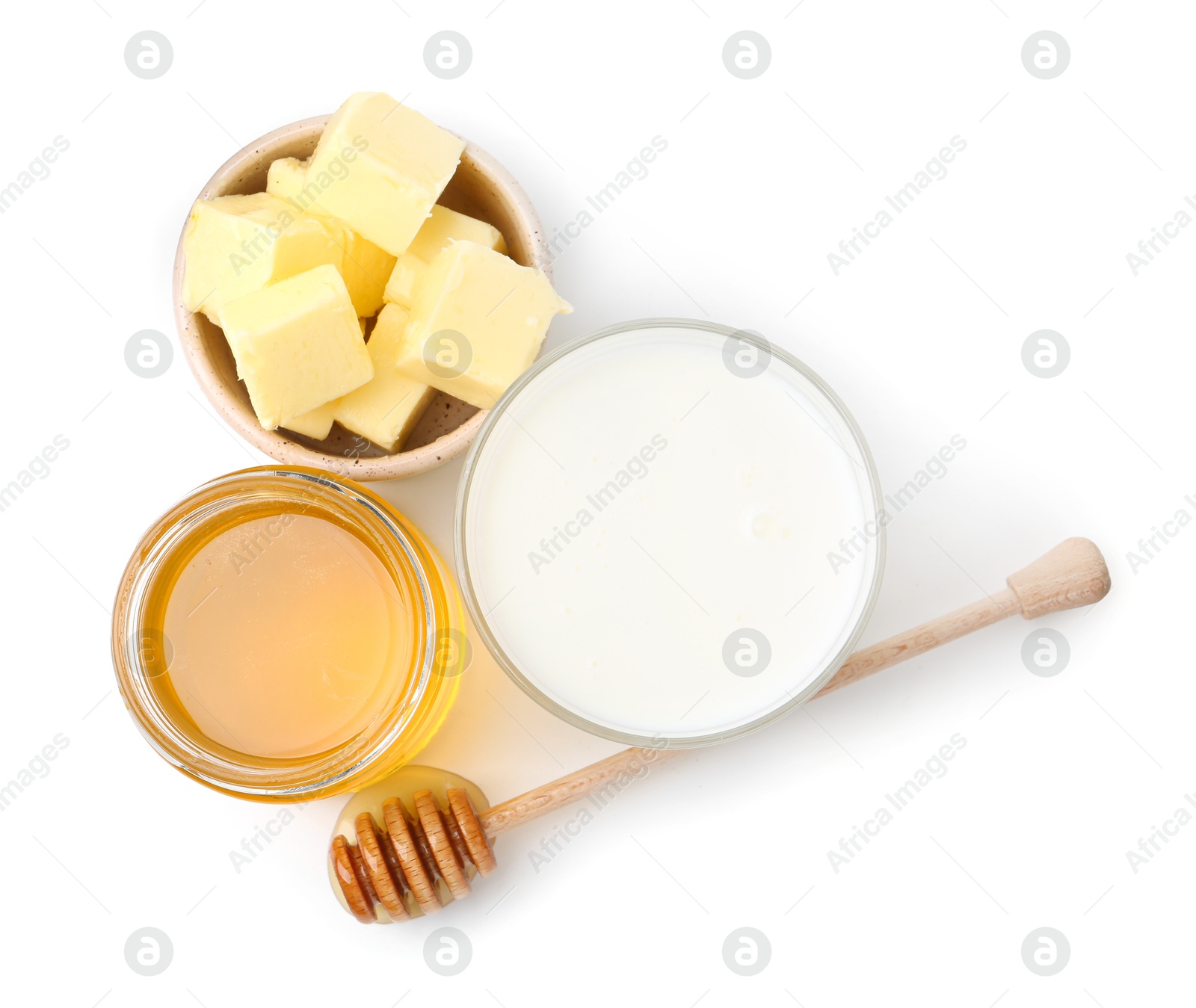 Photo of Sweet honey, butter and milk isolated on white, top view