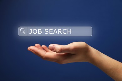 Image of Job search. Woman holding virtual search bar on blue background, closeup