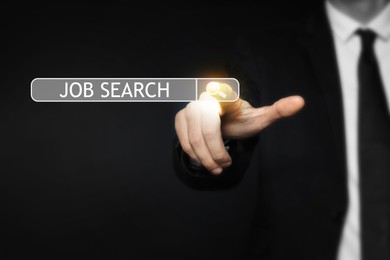 Job search. Businessman touching virtual search bar on black background, closeup