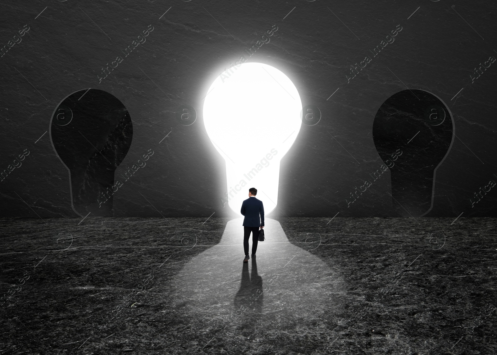 Image of Businessman walking towards glowing hole in shape of light bulb in dark stone wall. Idea, successful strategy