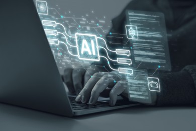 Image of Artificial intelligence. Man using laptop at table, closeup. Scheme with AI and other icons over computer. Toned in grey