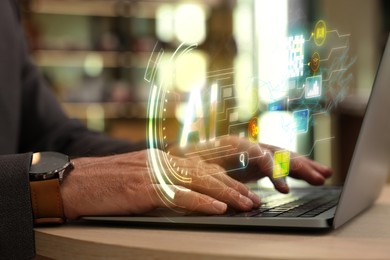 Artificial intelligence. Man using laptop at table, closeup. Scheme with AI and other icons over computer