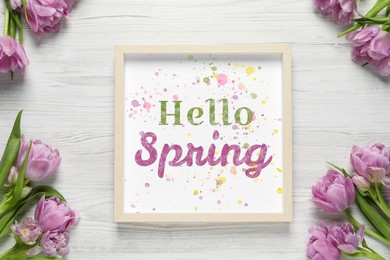 Image of Hello Spring card in frame and beautiful tulips on white wooden background, flat lay