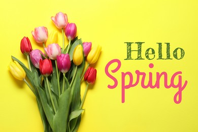 Image of Hello Spring. Bouquet of beautiful tulips on yellow background, top view