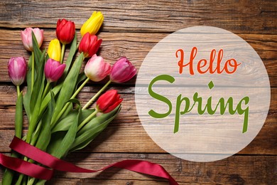 Image of Hello Spring. Bouquet of beautiful tulips on wooden background, top view