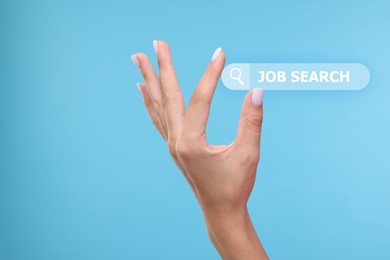 Image of Job search. Woman holding virtual search bar on light blue background, closeup