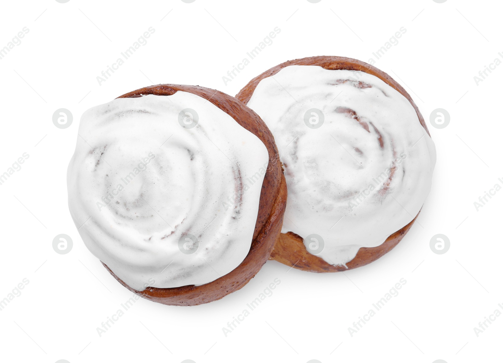 Photo of Tasty cinnamon rolls with cream isolated on white, top view