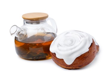 Photo of Tasty cinnamon roll with cream and tea isolated on white