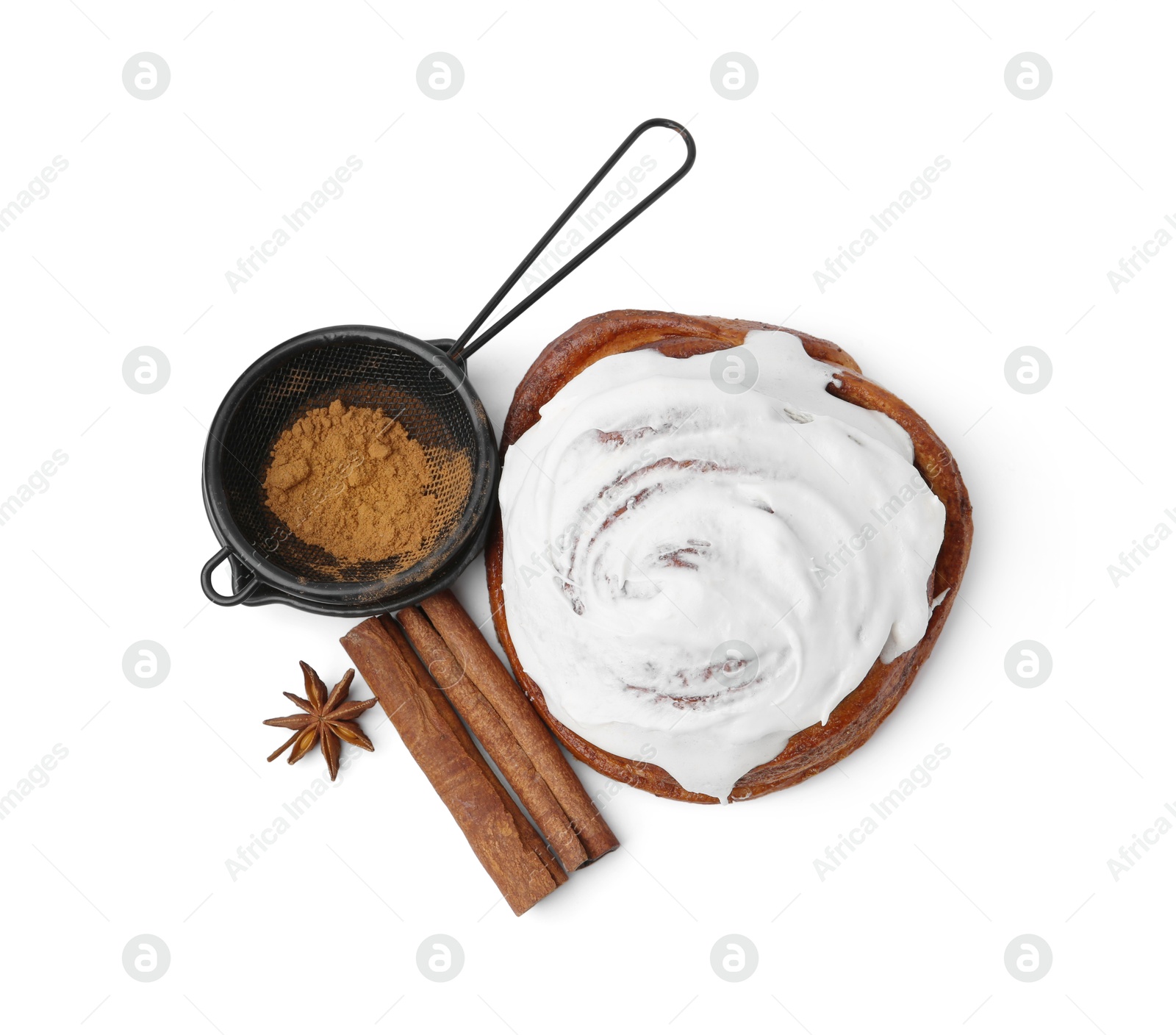 Photo of Tasty cinnamon roll with cream and spices isolated on white, top view