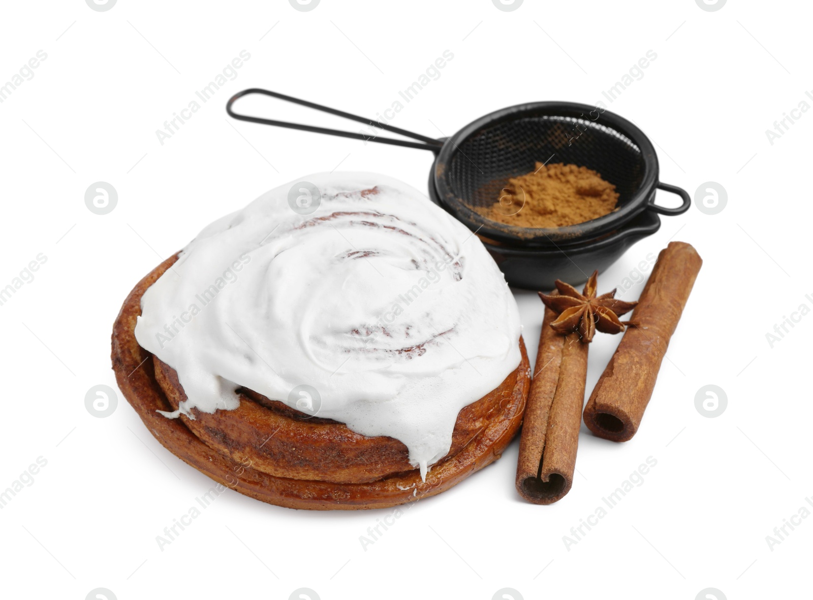 Photo of Tasty cinnamon roll with cream and spices isolated on white