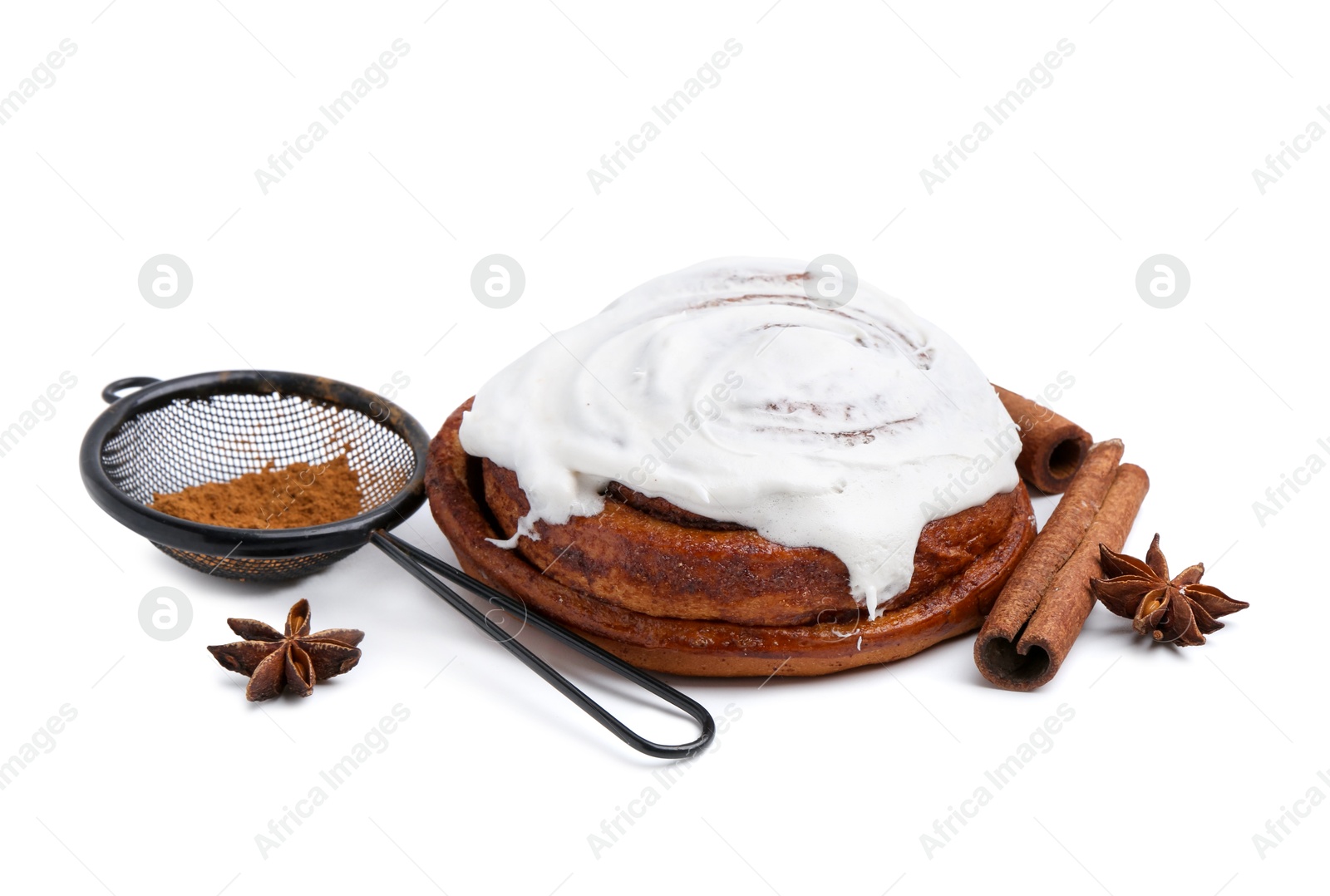 Photo of Tasty cinnamon roll with cream and spices isolated on white