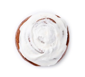 Photo of Tasty cinnamon roll with cream isolated on white, top view