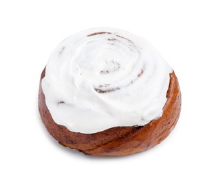 Photo of Tasty cinnamon roll with cream isolated on white