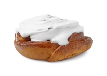 Photo of Tasty cinnamon roll with cream isolated on white