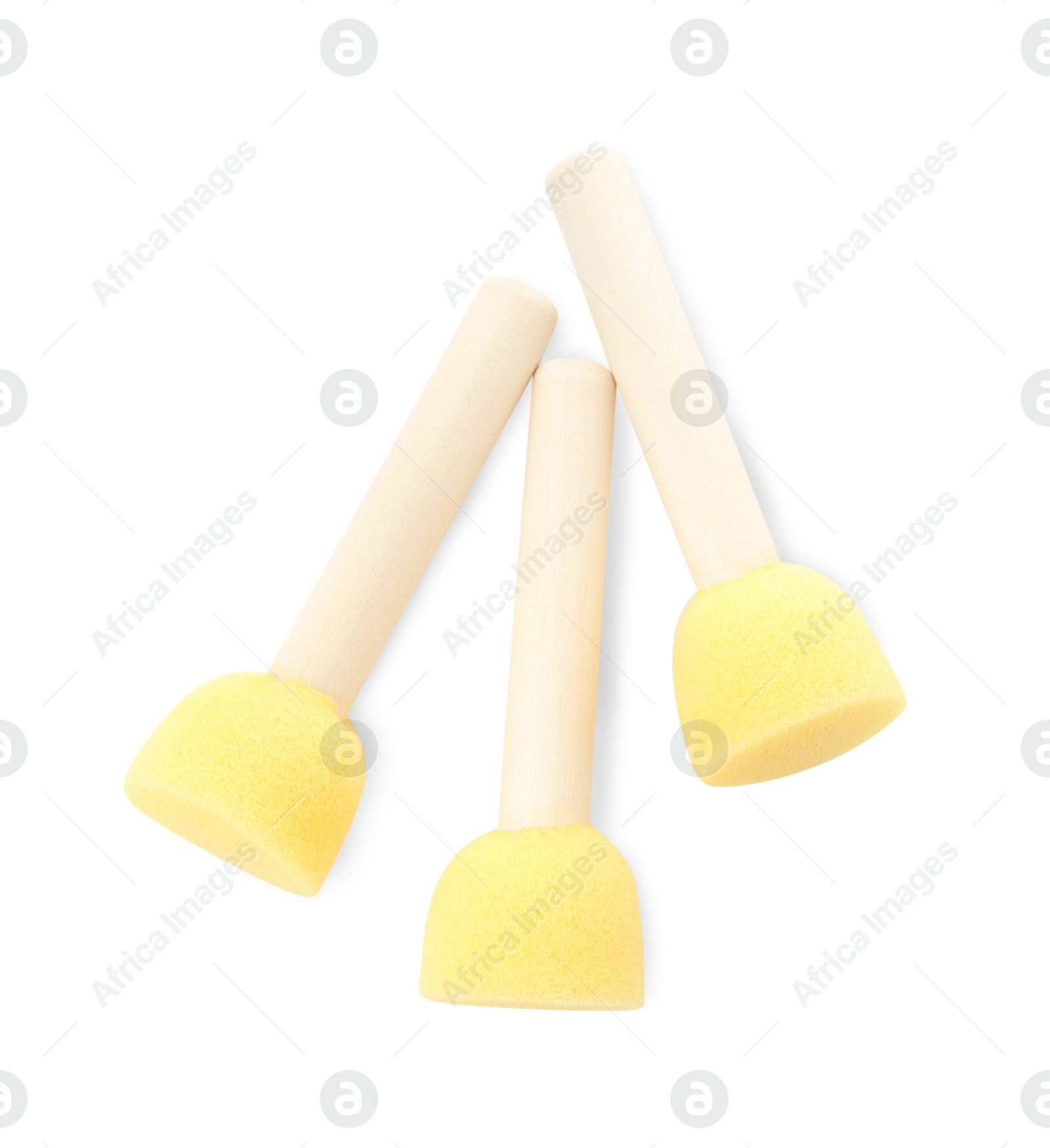 Photo of Three sponges for face painting isolated on white, top view