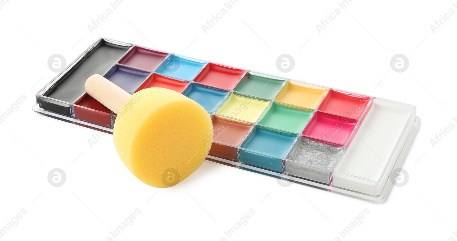 Photo of Bright face paint palette and sponge isolated on white